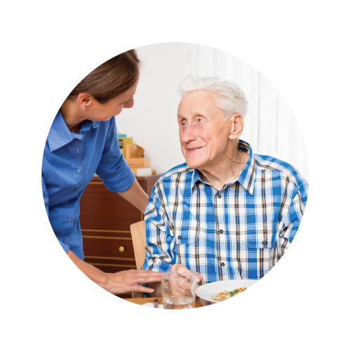 Clinical Services Dietician working with resident who is eating soup
